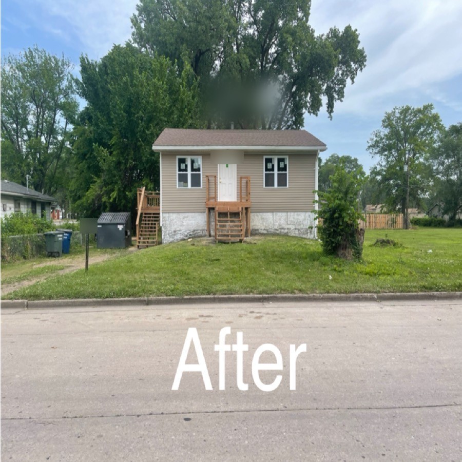 Front exterior after new siding.